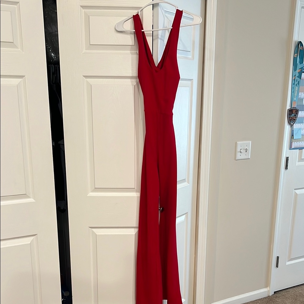 Red Jumpsuit with Deep V-Neckline and Fitted Bodice